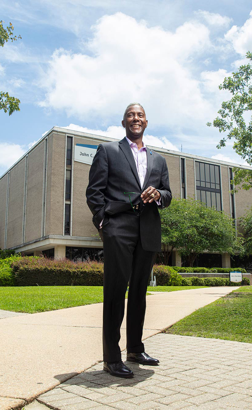 Alonzie Scott with the UWF Pace Library in the background