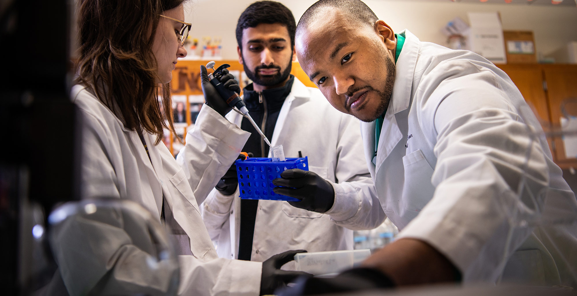 Joshua Brown and fellow researchers at work in a lab