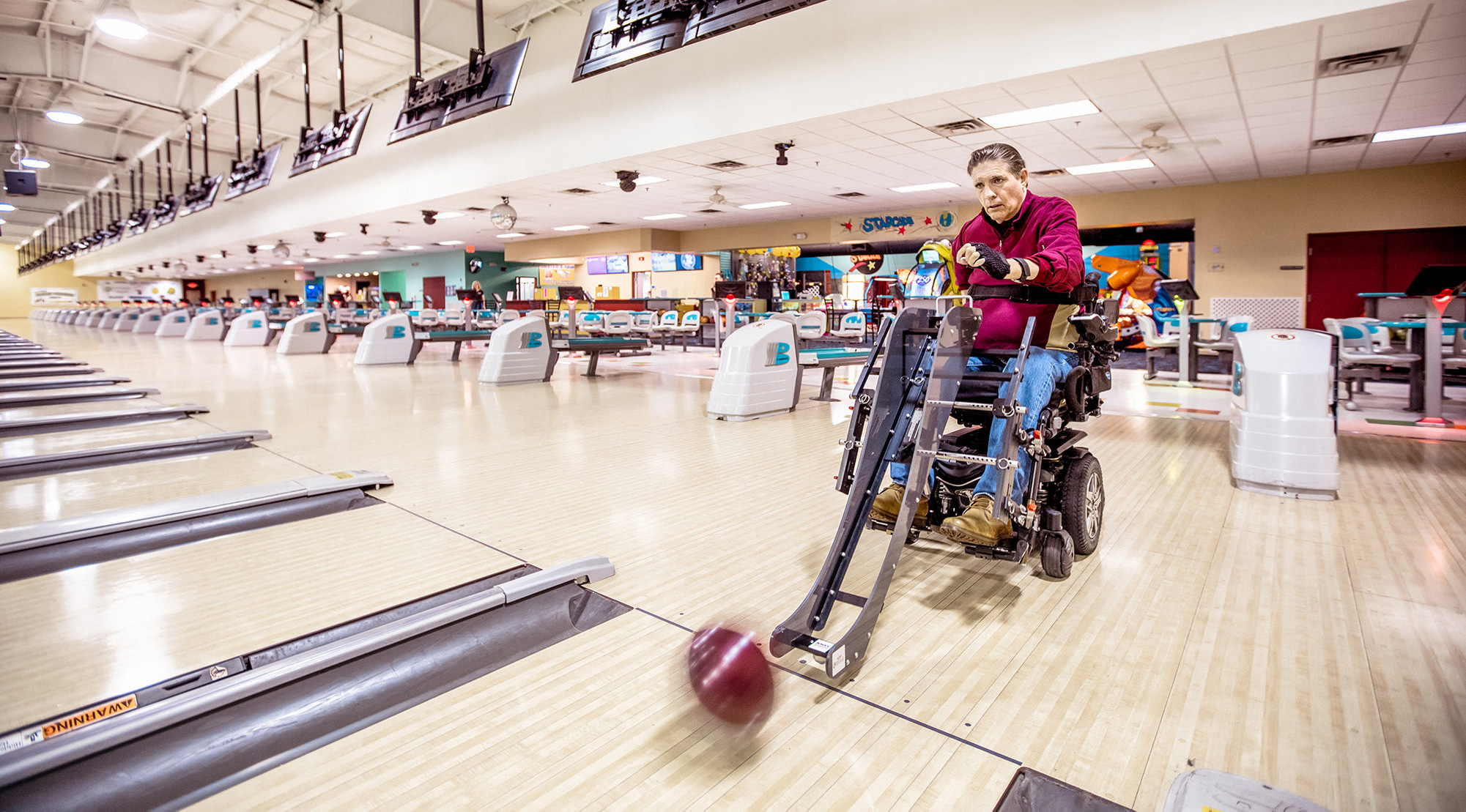 JR Harding bowling in a wheelchair