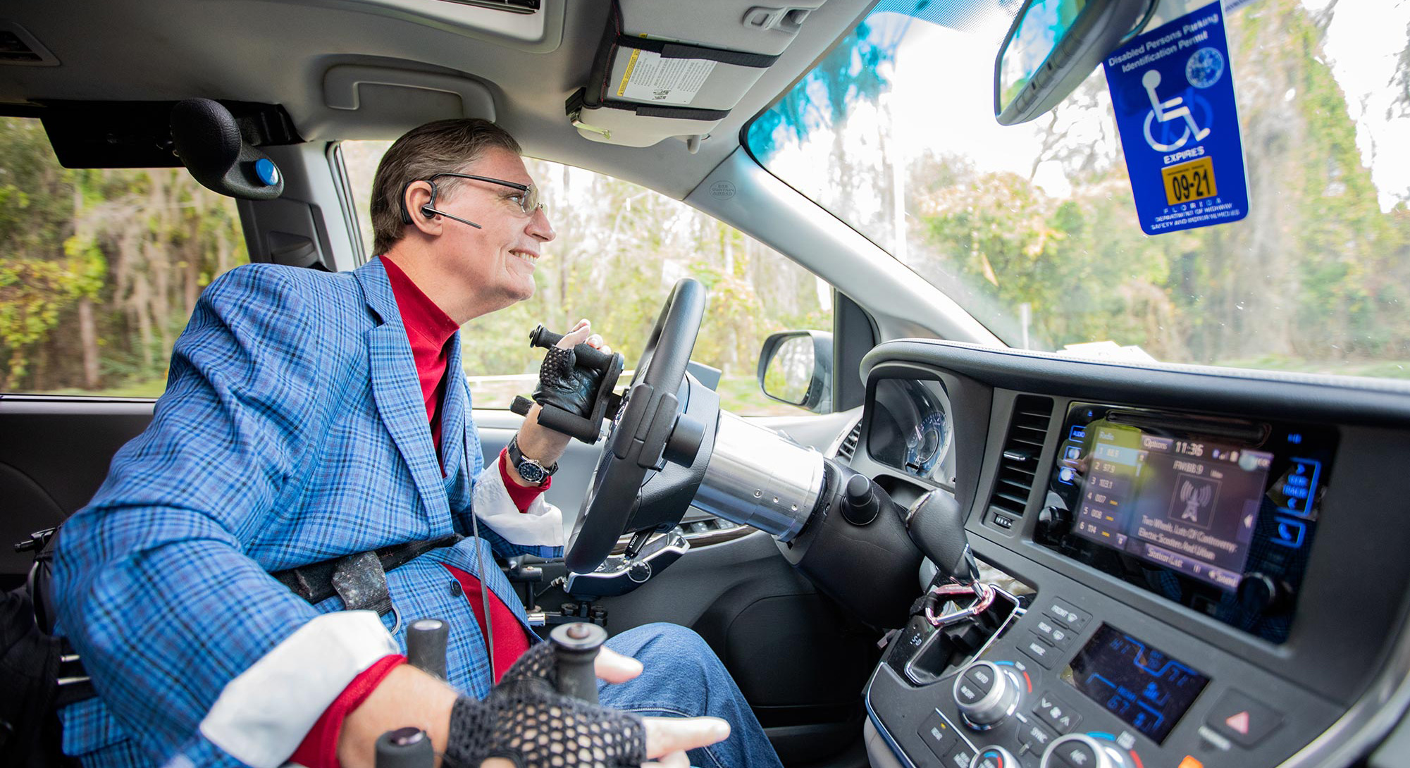 JR Harding driving in a handicap-accessible vehicle