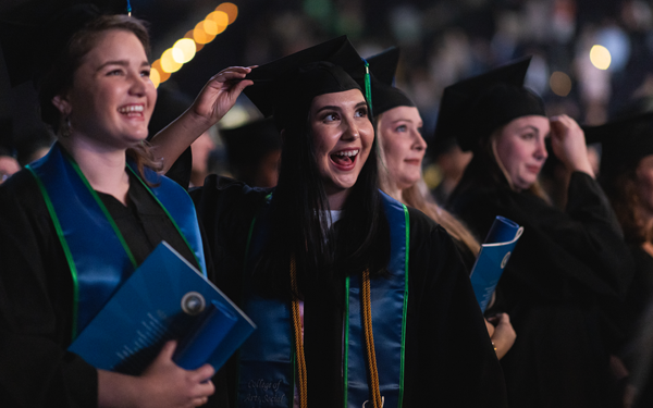 students showing happiness at commencement