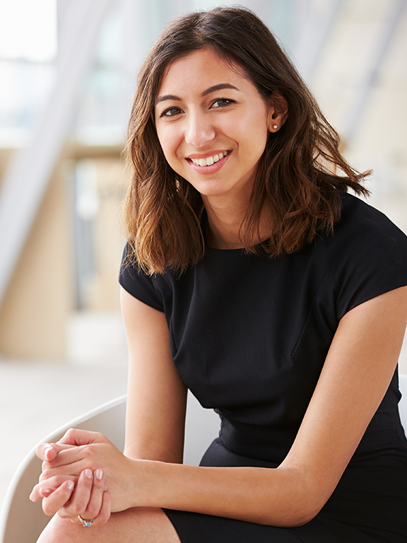Young professional woman smiling in office