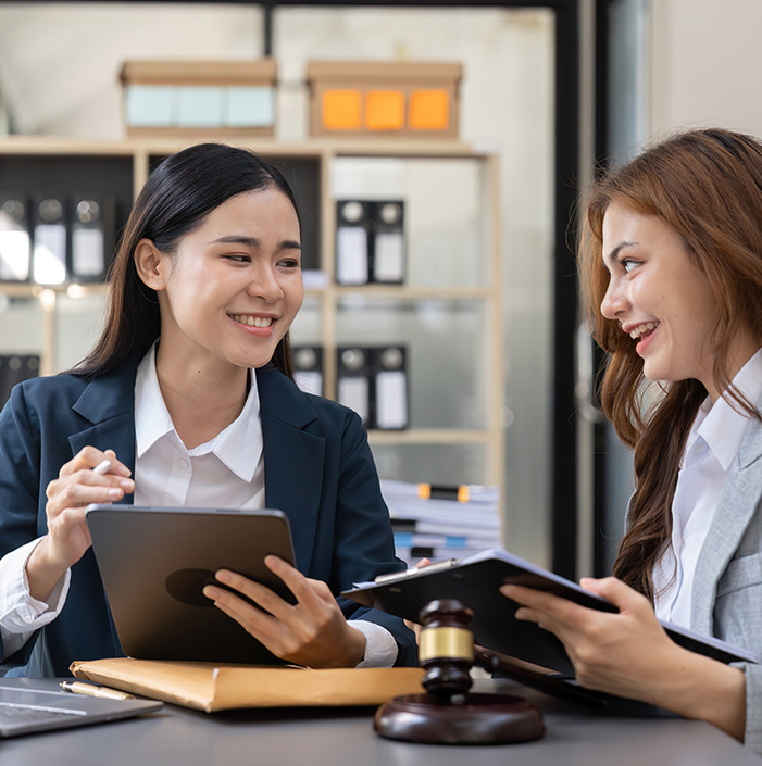 Two paralegals working in law office