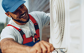 HVAC professional working on an air unit