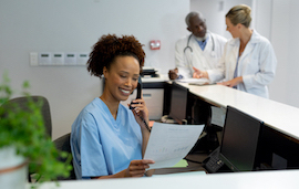 Medical assistant handling correspondence in a clinic 