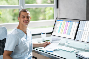 A medical billing and coding specialist organizing patient records and ensuring accurate billing and coding.
