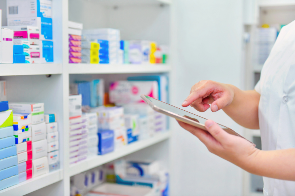 Pharmacist doing inventory of medicine