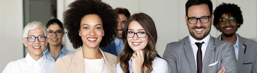 Business team in the office smiling at camera