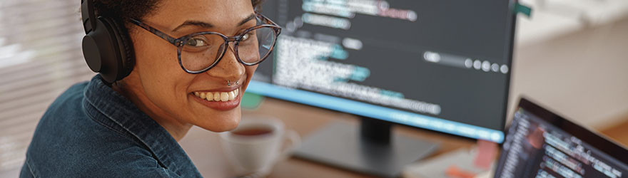 Software development employee at computer