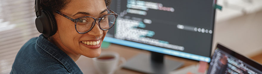 Software development employee at computer