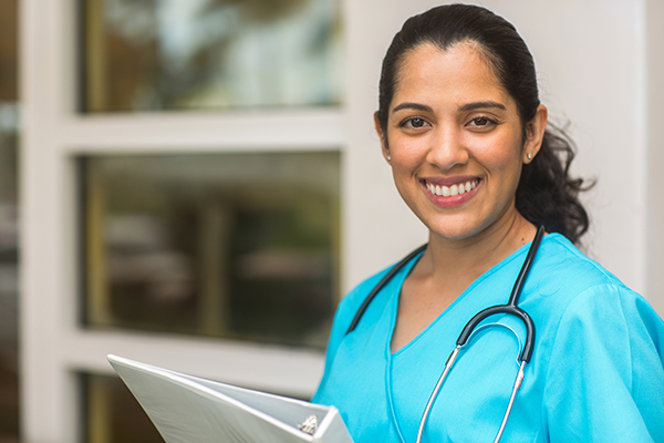 Medical Billing medical office employee smiling at the camera