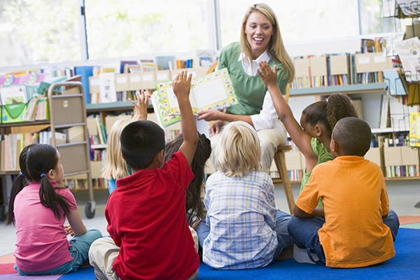 Teacher reading to students in the classroom