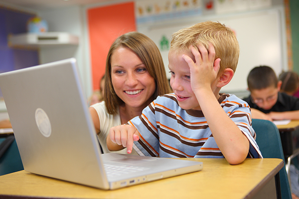 Teacher reading to students in the classroom