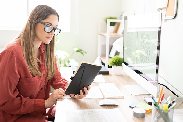 Writer in home office reading notes