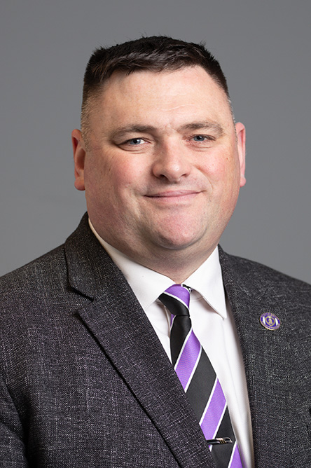 Andrew Del Gaudio indoor headshot.