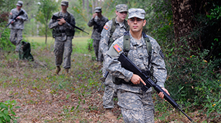 UWF Army ROTC students in uniform carrying firearms.