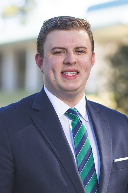 Alex Smith headshot in professional attire.