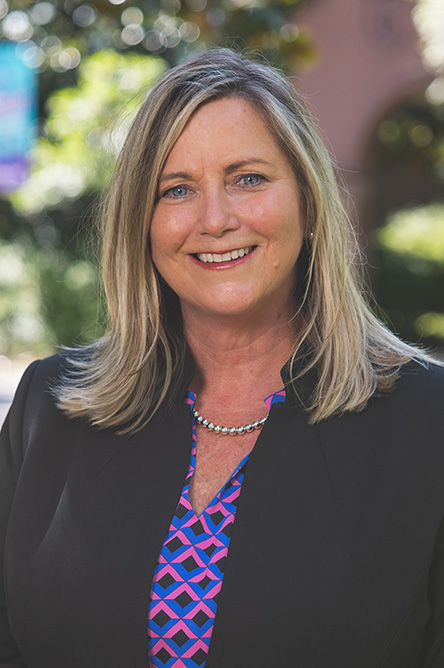 Mary Anderson outdoor headshot in professional attire.
