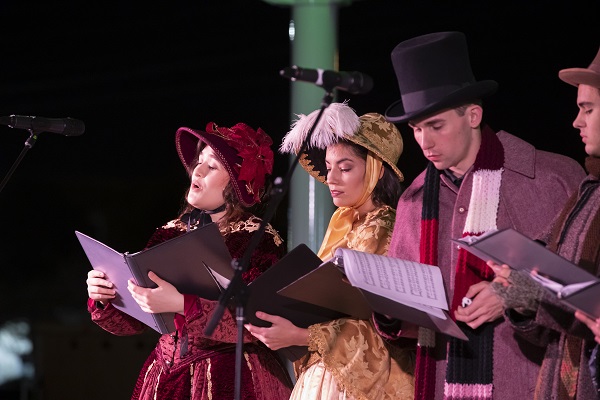 two carolers at holiday fest 2018