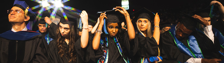 Graduates turn their tassels at commencement.