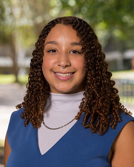 Azia Arosemena outdoor headshot.