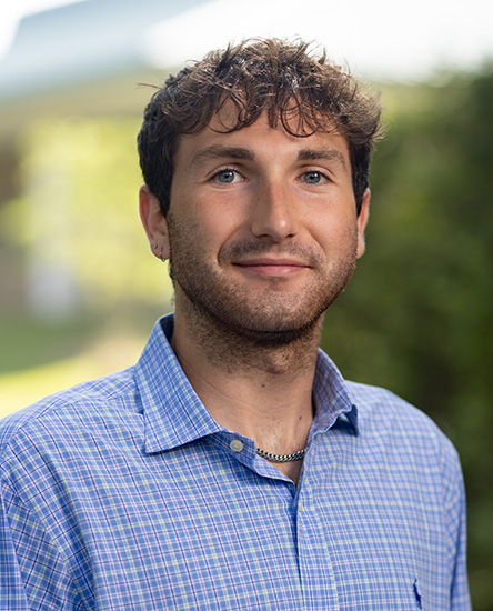 Kai Levy outdoor headshot.