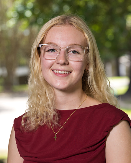 Paige Hennessy outdoor headshot.