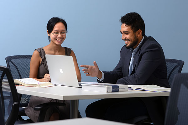 two students reviewing work in the accounting lab