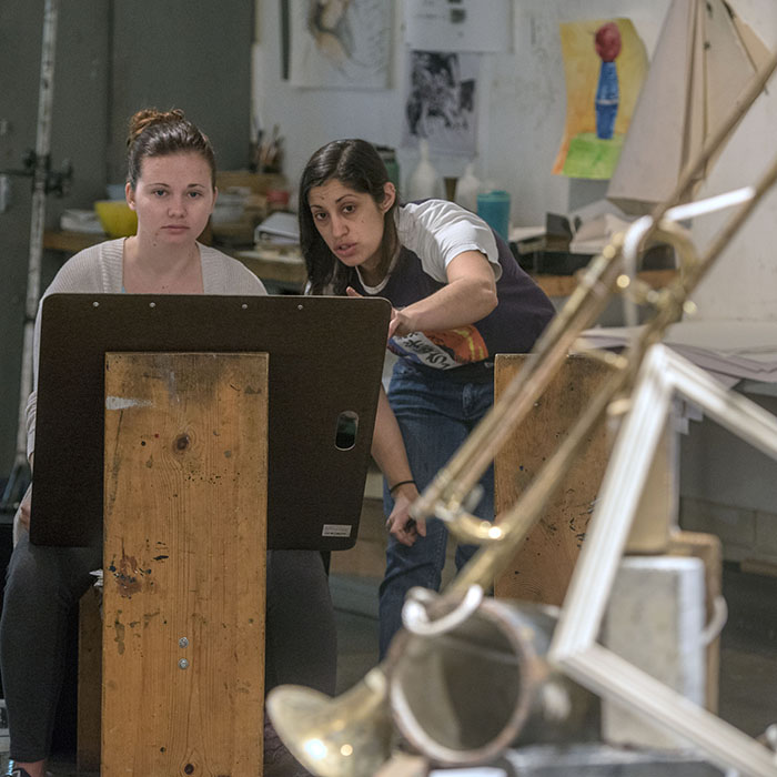 art student and instructor reviewing drawing techniques