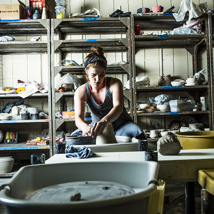 art student in a ceramics workshop