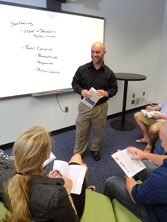 UWF Professor teaching a criminal justice class.