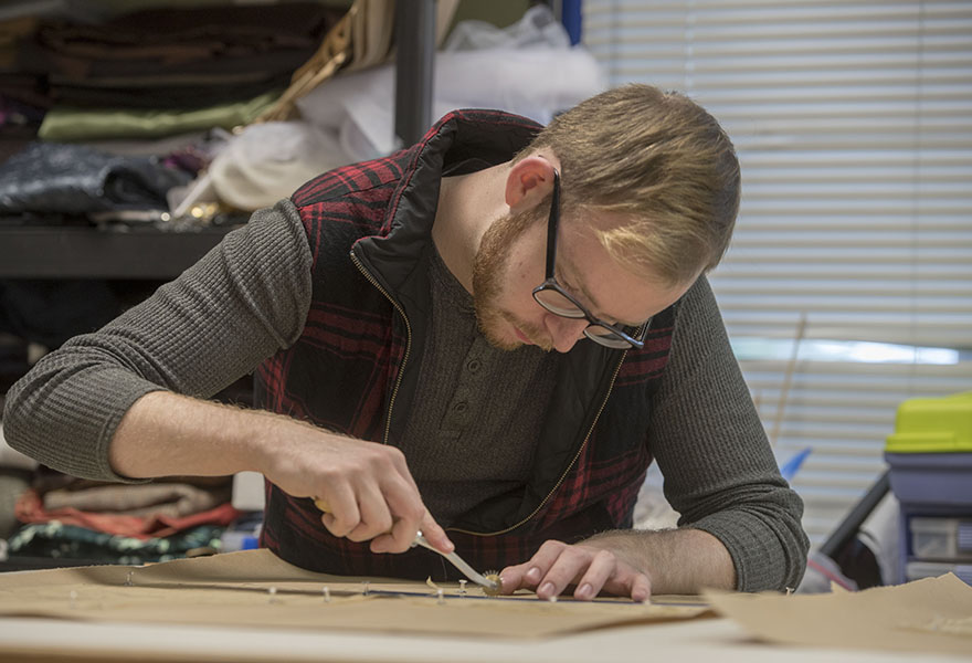 design and technology student working on stage props