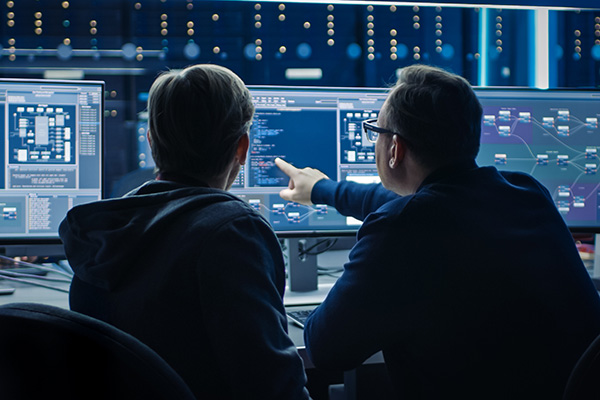 computer science student working at a desktop computer