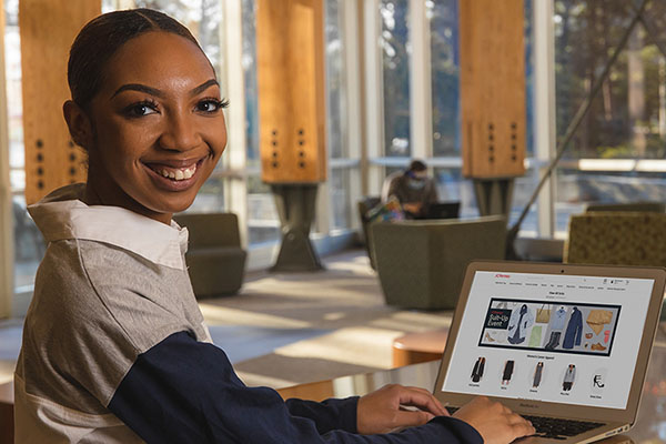 digital marketing student researching e-commerce websites