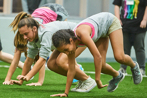 health and physical education students practicing exercises in the uwf pedagogy gym