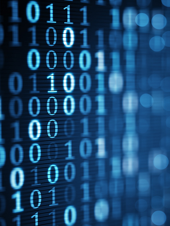 Close up of a computer screen with binary code displayed.