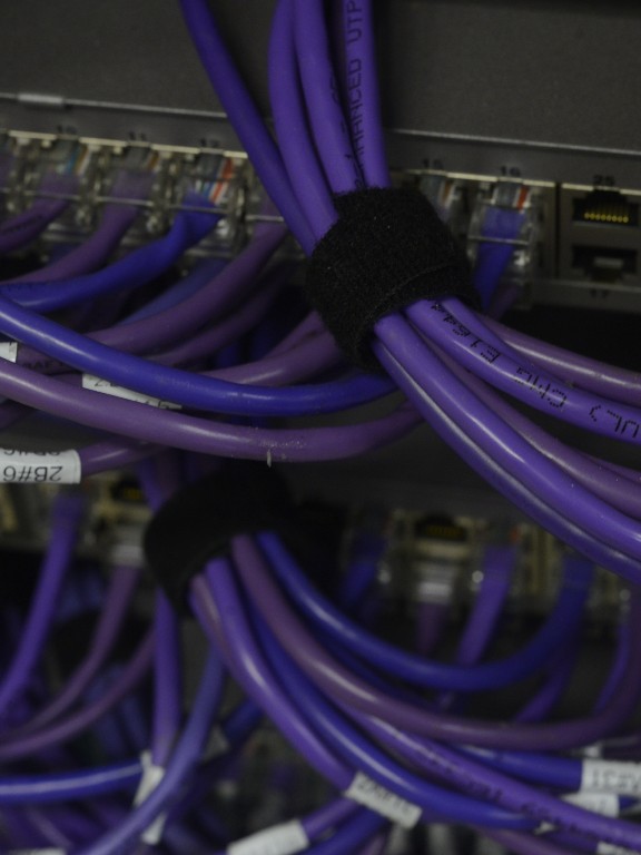 cables plugged into a network router