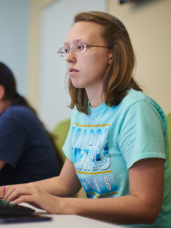 a female student working in a computer lab
