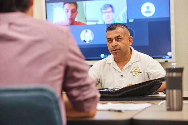 international affairs students in a virtual and in person hybrid classroom