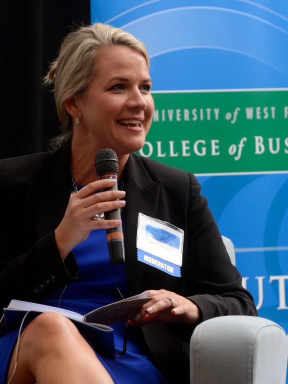 Moderator speaking at a leadership conference	