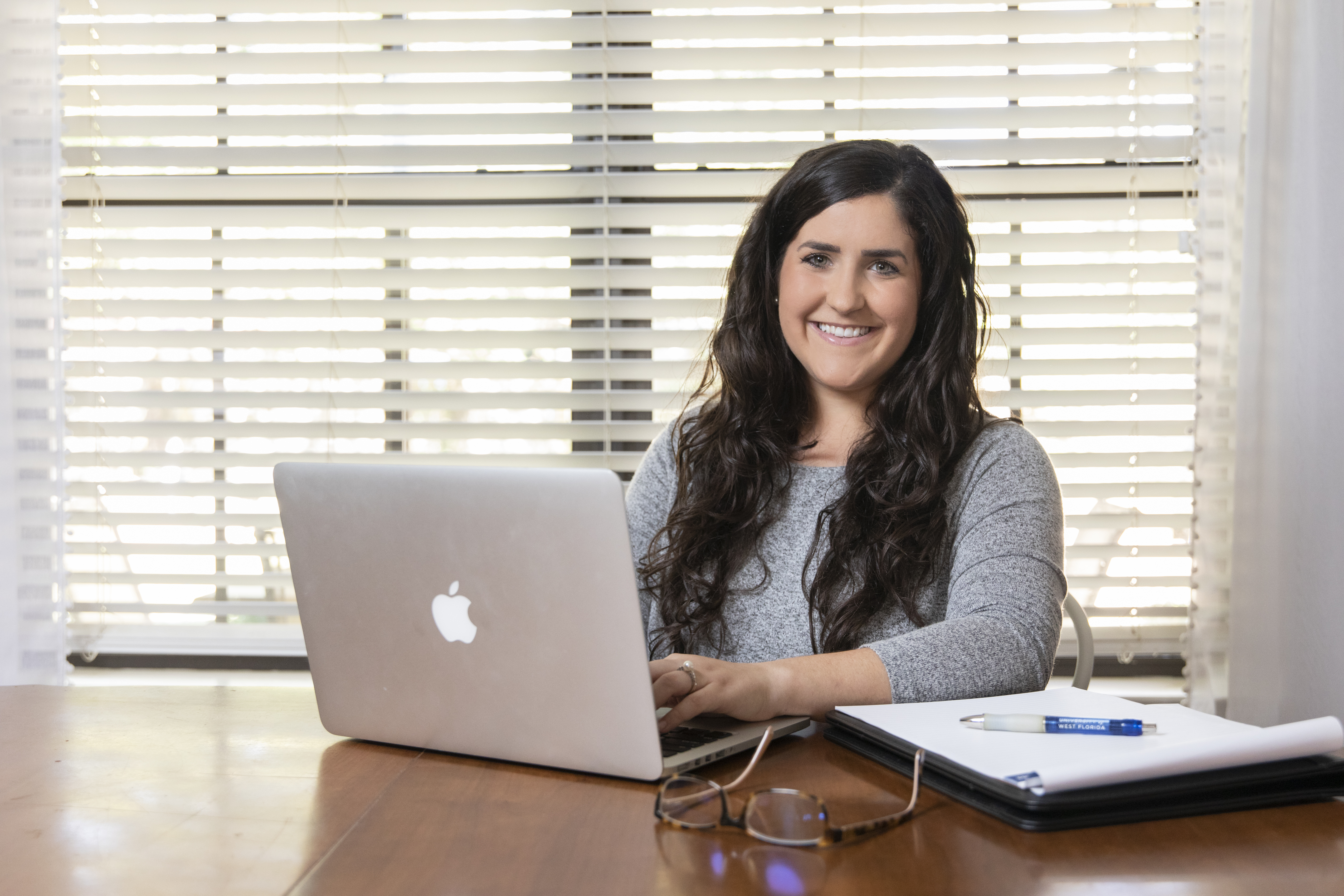 Professional with laptop at home taking online courses