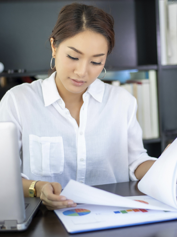 Business professional looking at charts.