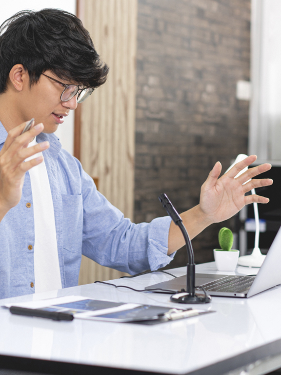 Teacher using technology for virtual instruction.