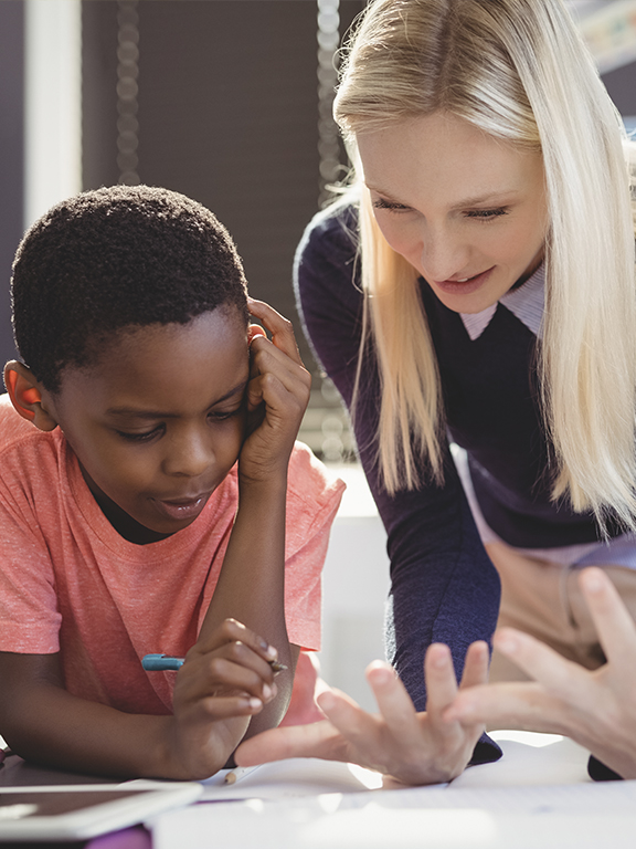 Behavior Analyst working with a child during therapy session