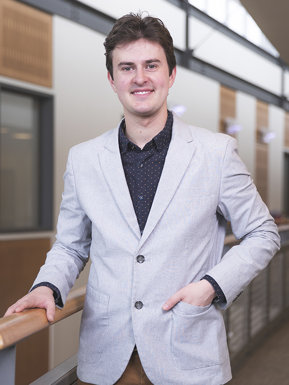 Business student smiling at camera