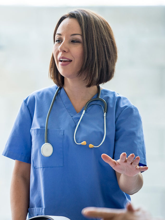 Female nurse teaching students