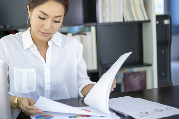 Business professional looking at charts.