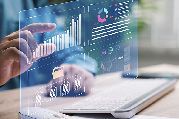 Data analyst touching a display screen displaying data graphs.