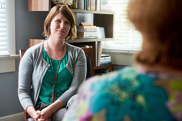 Social worker listening to a client