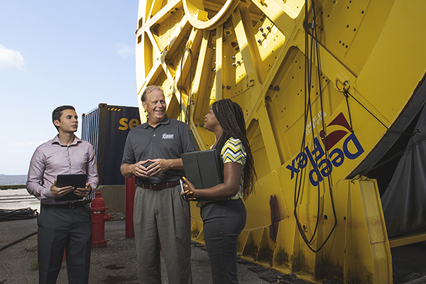Supply chain professor with students at a port.